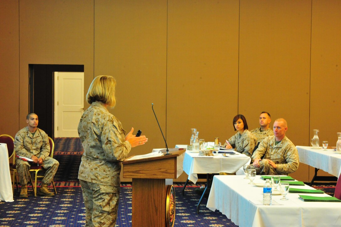 Marines listen as Chief Warrant Officer Dancy Simons, trial services administrative officer, gives a brief on legal policy at The Clubs at Quantico on Oct. 10, 2013. More than two-dozen service members attended the brief as a refresher course for current legal issues.