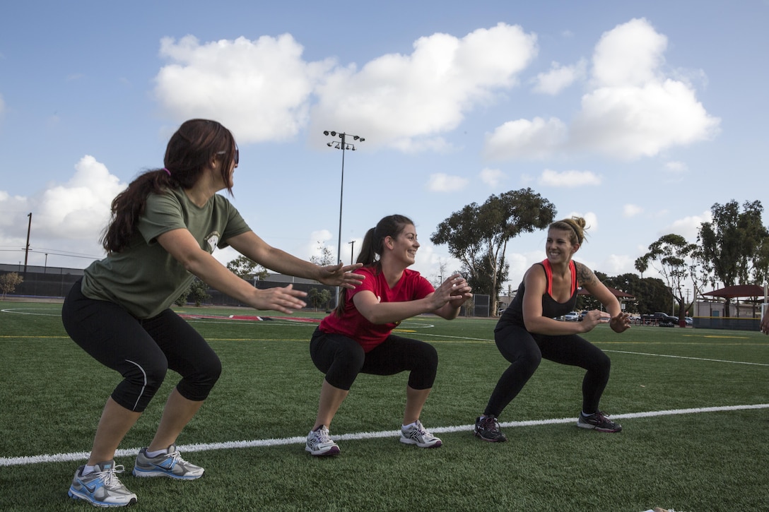 Ashley Pate, center, a Marine wife, leads a work out for spouses to help get in shape for this year’s Marine Corps Ball, aboard Marine Corps Air Station Miramar, Calif., Oct. 10. Pate also works with Marine Wing Support Squadron 373 as a command team advisor to organize events to bring spouses closer together.