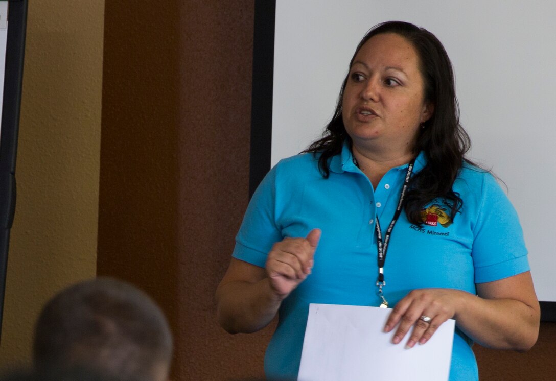 Lorraine Nisbet, a Marine spouse and active volunteer, teaches a class to Marines about preparing for a move aboard Marine Corps Air Station Miramar, Calif., Sep. 20. As part of the Committed and Engaged Leadership Initiative, spouses like Nisbet are being recognized for their work giving back to the community.