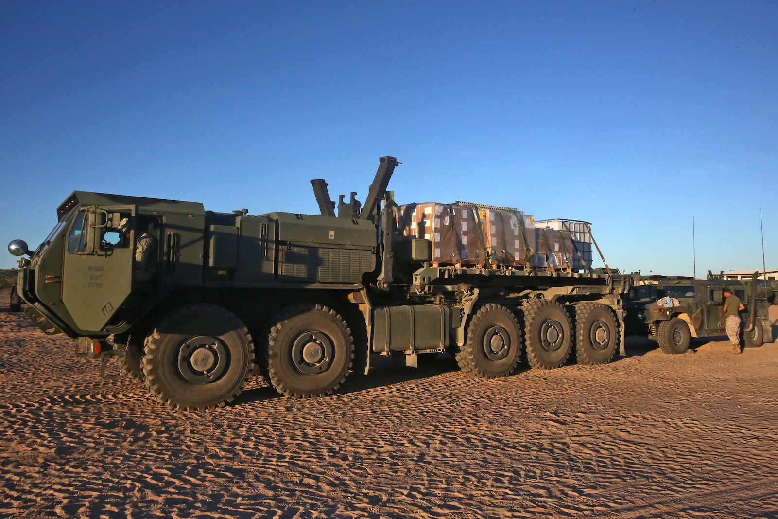 Motor vehicle operators with General Support Motor Transport Company, Combat Logistics Regiment 1, 1st Marine Logistics Group, prepare a food supply convoy during Weapons and Tactics Instructor Course 1-14 in Yuma, Ariz., Oct. 3, 2013. Daily convoys were organized by CLC-16 to provide food, fuel and equipment across Arizona in support of WTI 1-14 and traveled as far as 350 miles for a single resupply operation.  