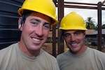 Brothers Army Spc. Waylon Blasius and Army Spc. Weston Blasius take a break from work at the Pater van der Pluym School in Suriname's Brokopondo district Aug. 1, 2011. Both brothers are carpentry and masonry specialists assigned to the South Dakota Army National Guard's 155th Engineer Company. Soldiers from the 155th are in Suriname as part of New Horizons 2011, a joint humanitarian mission between the Suriname government and the U.S. Southern Command with the goal of helping to improve the quality of life for the people of Suriname. South Dakota and Suriname are paired in the National Guard's State Partnership Program.