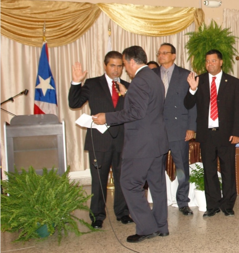 The gavel is passed as the 2013-2014 Board of Directors for the Ponce Chapter of the Association of Engineers and Surveyors of Puerto Rico is sworn in. New president Pablo Vázquez-Ruiz (left) was sworn in by the outgoing president of the CIAPR. 