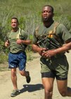 Master Sgt. Ricardo Russo, left, runs with a U.S. Marine Corps Staff Non-Commissioned Officer Academy classmate during a physical training session at Camp Pendleton, Calif. (Courtesy photo)
