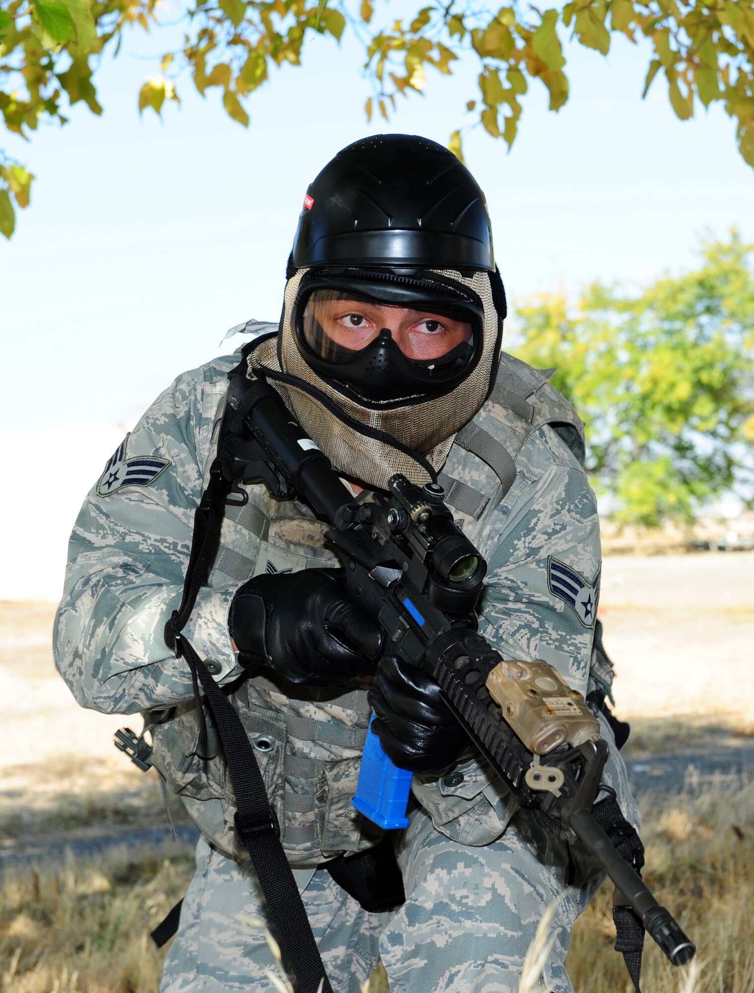 Senior Airman Jude Mares, 9th Security Forces Squadron patrolman, scans for enemy combatants during a pilot-rescue exercise at Beale Air Force Base, Calif., Oct. 9, 2013. Airmen coordinated the simulated rescue with an orbiting MC-12W Liberty aircrew. (U.S. Air Force photo by Airman 1st Class Bobby Cummings/Released)