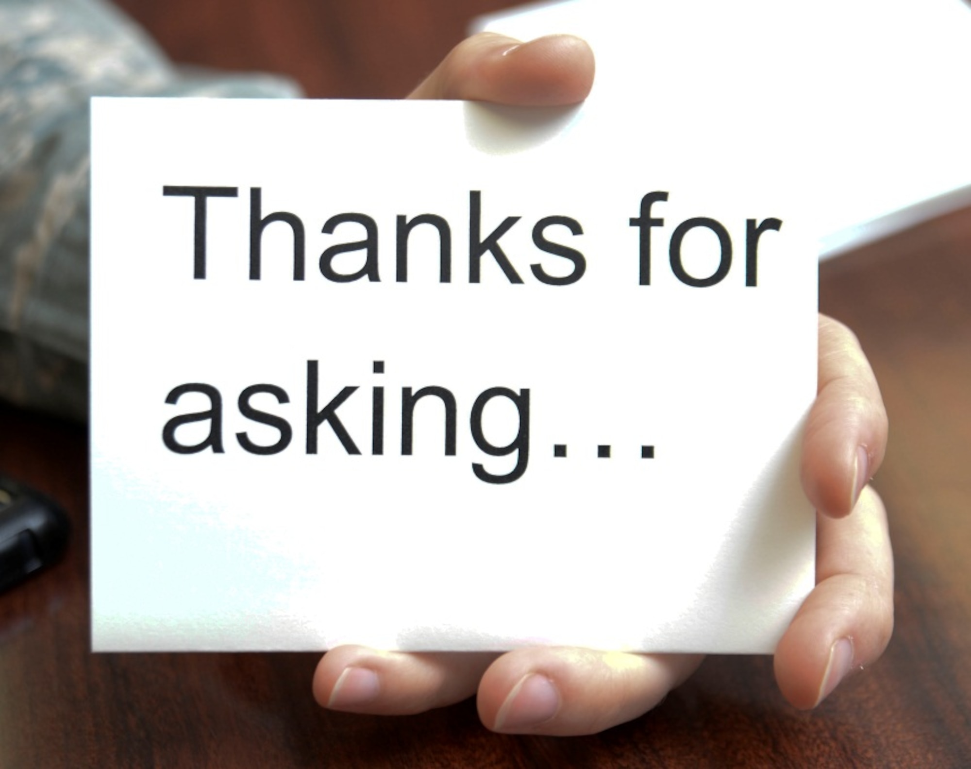 “Thanks for asking…” cards are given out to those who asked about a bruise during the Black Eye Campaign at Hurlburt Field, Fla., Oct. 9, 2013. The campaign was held by Family Advocacy to raise awareness for domestic violence. (U.S. Air Force photo/Airman 1st Class Andrea Posey)