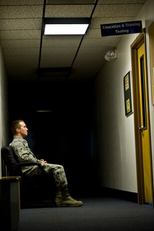 An Airman waits to take his Career Course Development end of course exam in the hall outside of the 99th Force Support Squadron Education and Training Testing Room Oct. 11, 2013, at Nellis Air Force Base, Nev. The 99th FSS will continue to provide professional military education testing throughout the government shutdown. (U.S. Air Force photo by Airman 1st Class Christopher Tam)