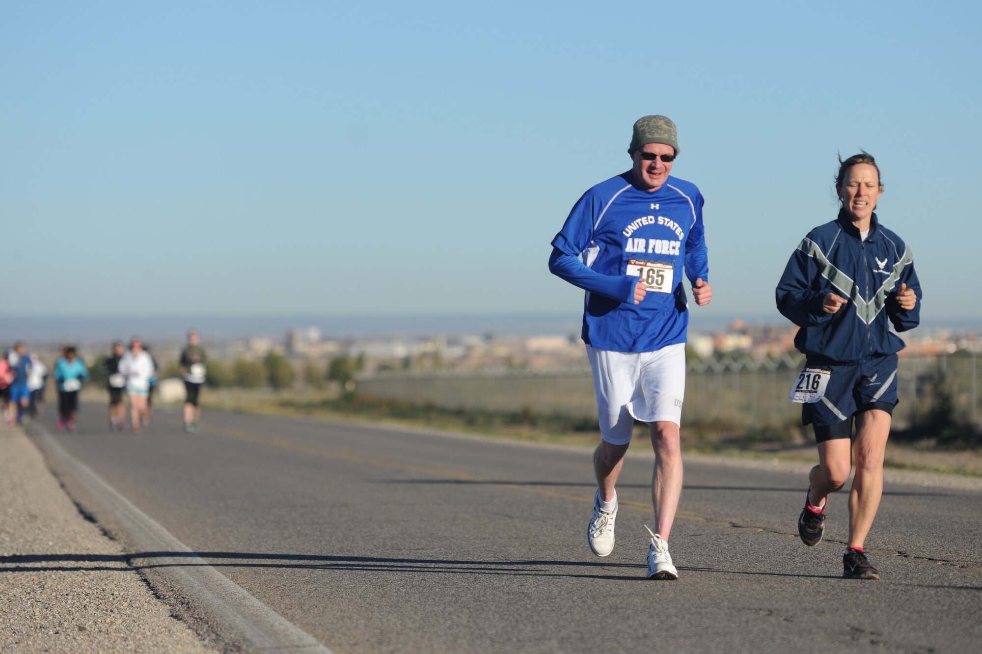 Col. Heather Pringle, right, 377th Air Base Wing vice commander, and Maj. Andrew Green, a wounded warrior from the Air Force Nuclear Weapons Center, are two of more than 70 participants who braved the cold weather to run in the Wounded Warrior Half Marathon and 5K.  The race was hosted by the 377th Force Support Squadron Oct. 12 at the Tijeras Arroyo Golf Course. (Photo by Todd Berenger)