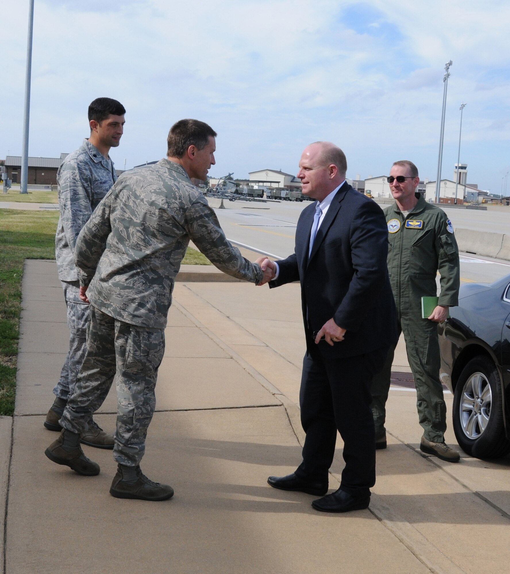 Mr. Jason Forrester, Deputy Assistant Secretary of Defense (Manpower and Personnel) in the Office of the Assistant Secretary of Defense (Reserve Affairs) is greeted by Lt Col. Thomas “Bear” Mcatee, 192D Fighter Wing Maintenance Squadron commander and Lt. Col. Matt Hummel, 192D FW Aircraft Maintenance Squadron commander.  Mr. Forrester viewed the F-22 Raptor, toured various facilities, met with Virginia Air National Guard members and received a guided tour of the 192D Intelligence Squadron, where he received a mission overview of intelligence state and federal capabilities. (U.S. Air National Guard photo by Master Sgt. Carlos J. Claudio/Released)