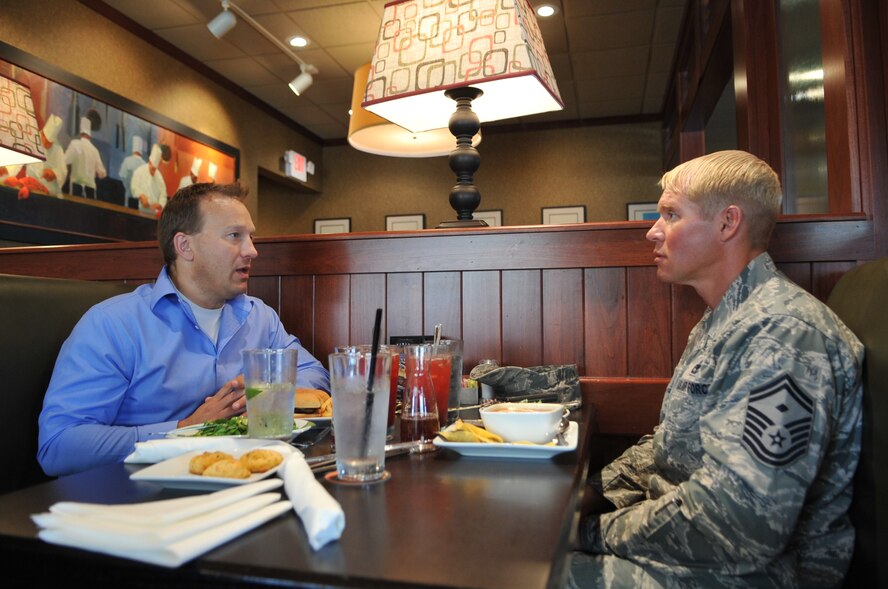 Brian Pabst, an Amazon employee, and Senior Master Sgt. Brian Stone, 69th Reconnaissance Group first sergeant, have lunch together at a local Grand Forks, N.D. establishment, Aug. 8, 2013. Pabst and Stone met through a “Leaders for Life” course and began a friendship that has continued after the class. (U.S. Air Force photo/Staff Sgt. Amanda N. Grabiec)