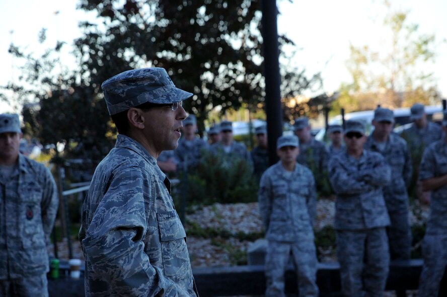 Col. Bill Liquori, 50th Space Wing commander, addresses members of the 50th Space Wing regarding the government shutdown after a wing-wide reveille ceremony early Oct. 3 here. Wing leadership continues to use multiple methods to ensure members of Team Schriever have the most up-to-date information regarding the government shutdown. (U.S. Air Force photo/Staff Sgt. Patrice Clarke)