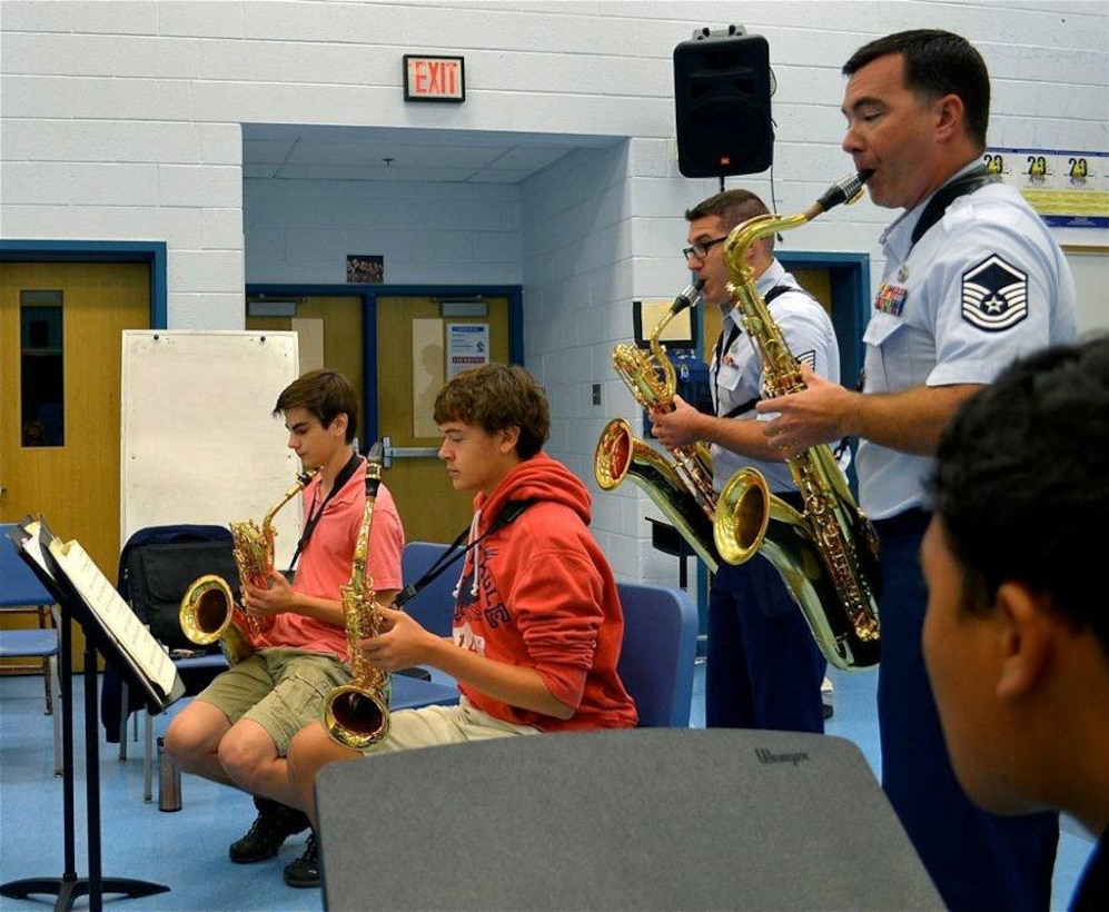 Master Sgt. Jake McCray and Technical Sgt. Ricky Parrell perform with West Potomac High School saxophone students at an AIM event on Oct. 1 (Photo by Karl Hovey)
