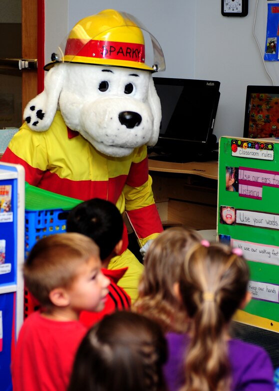 Sparky the fire dog visits the Langley Child Development Center during Fire Prevention Week at Langley Air Force Base, Va., Oct. 10, 2013. Firefighters with the 633rd Civil Engineer Squadron visited various locations on base and demonstrated proper fire safety and evacuation procedures. (U.S. Air Force photo by Airman Areca T. Wilson/Released)