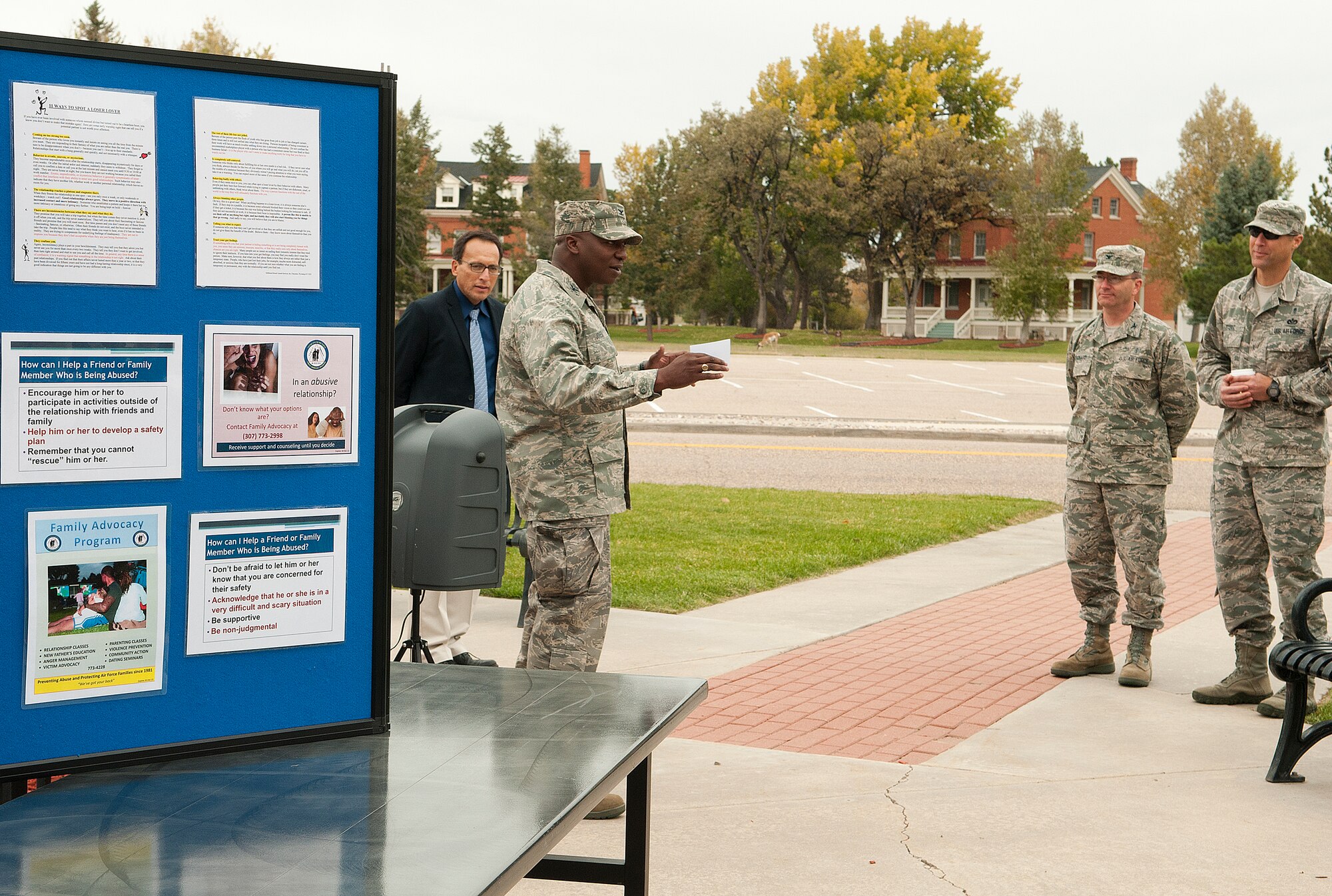 Col. Carl Jones, 90th Missile Wing vice commander, makes opening comments at the start of the F.E. Warren Purple Lighting Ceremony and confidence course challenge in front of the Fall Hall Community Center Oct. 10, 2013. The event, sponsored by the Domestic Violence Awareness Committee, included informational displays and physical challenges to bring attention to domestic violence. (U.S. Air Force photo by R.J. Oriez)
