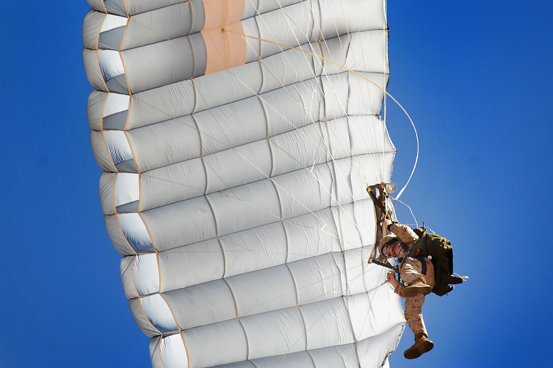 A U.S. Marine glides in the air after jumping out of an MV-22 Osprey Oct. 1, 2013, at Melrose Air Force Range, N.M. The 22nd Marine Expeditionary Unit from Marine Corps Base Camp Lejeune, N.C., utilized Melrose Range to set a new distance record for the MV-22.  (U.S. Air Force photo/Senior Airman Jette Carr)