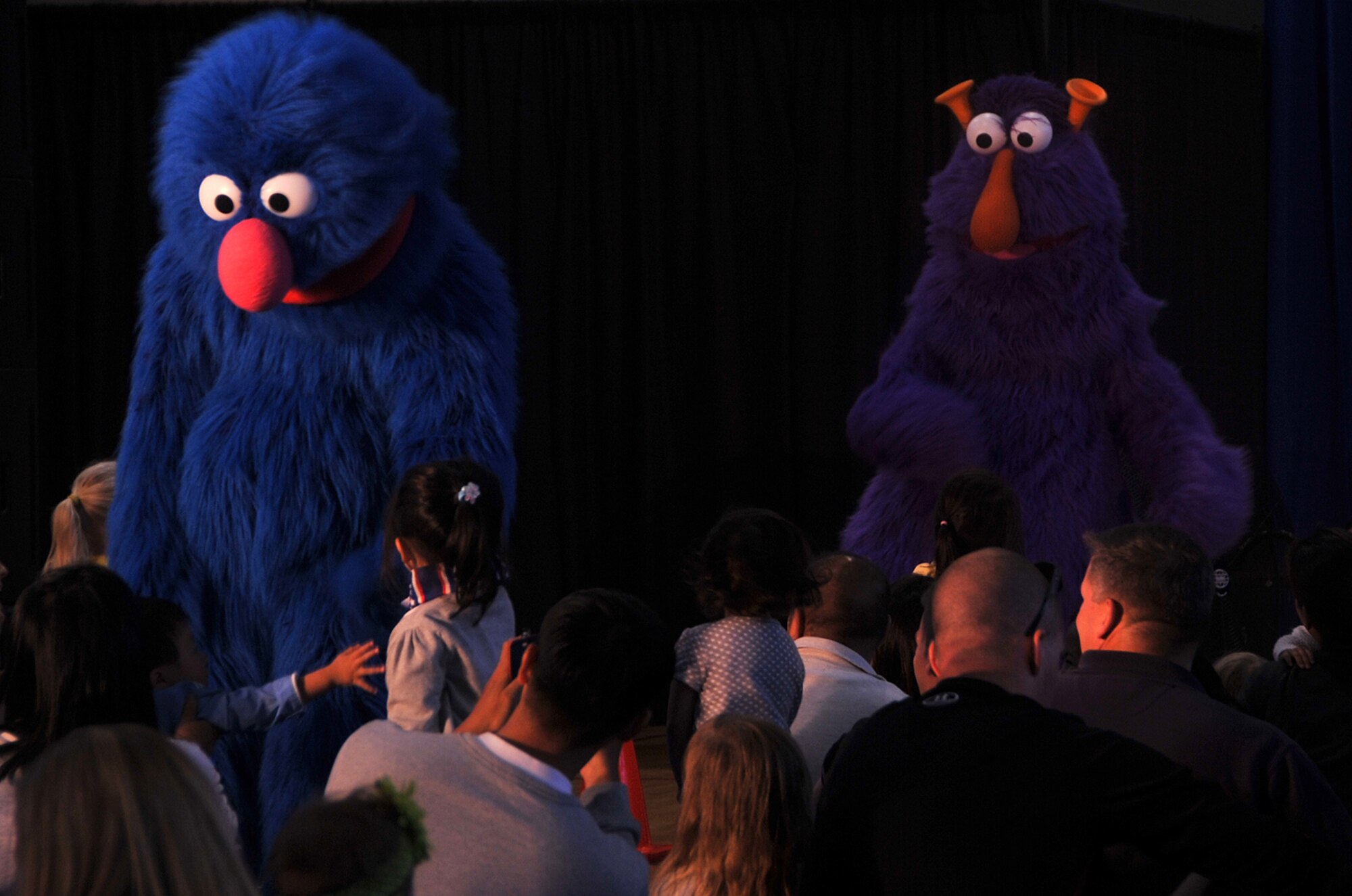 Sesame Street performers shake hands with audience members at the Fitness Center on Osan Air Base, Republic of Korea, Oct. 11, 2013. The performance was part of the Sesame Street Workshop and United Service Organization’s “Talk, Listen, Connect” program that was launched in 2006 as a bilingual educational outreach initiative designed for military families and their children. (U.S. Air Force photo/Senior Airman Kristina Overton)