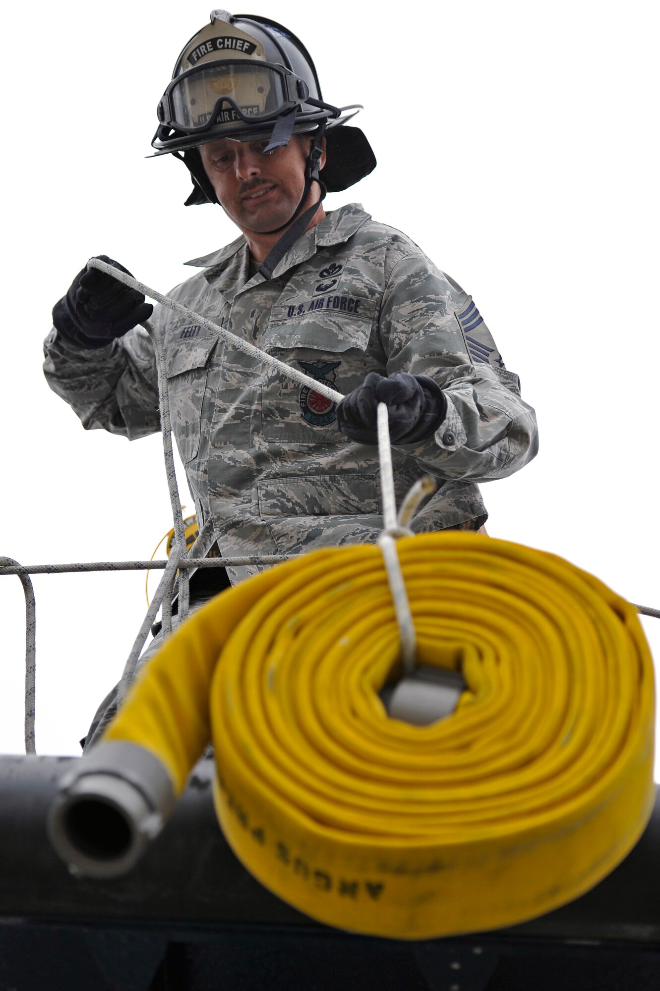 Chief Master Sgt. Jeffrey Felty, 35th Civil Engineer Squadron, participates in the fire muster competition at Misawa Air Base, Japan, Oct. 6, 2013. This is the eighth annual fire muster competition between base Airmen and local Japanese fire departments. The competition was held in conjunction with Fire Prevention Week. (U.S. Air Force photo by Airman 1st Class Zachary Kee)