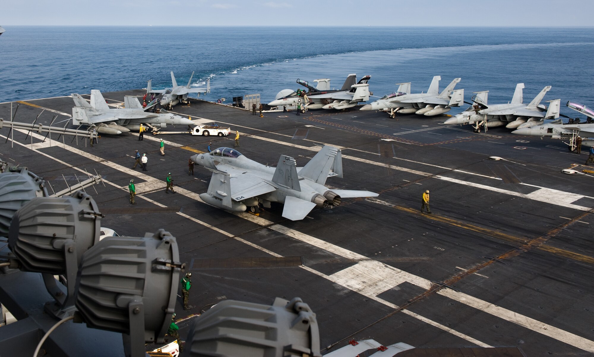U.S. Navy sailors conduct routine operations onboard the USS George Washington (CVN 73) Oct. 10, 2013. The Navy “Providers” of Fleet Logistics Support Squadron (VRC) 30 gave the Wolf Pack an opportunity to view both the Providers’ mission as well as the USS George Washington’s mission. (U.S. Air Force photo by Senior Airman Armando A. Schwier-Morales/Released)