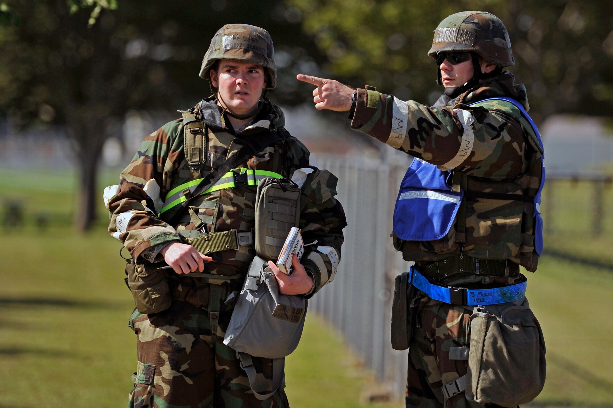 U.S. Air Force Tech. Sgt. Stephen Morin, 35th Maintenance Group Wing Inspection Team member, points out the location of simulated unexploded ordnance to Staff Sgt. Jarriott Bennett, 35th Maintenance Squadron precision measurement equipment laboratory technician, during a post attack reconnaissance sweep at Misawa Air Base, Japan, Oct. 10, 2013. To be a part of WIT, members must show good work-ethic and be able to ensure Airmen are performing exercise scenarios properly and with a sense of urgency. (U.S. Air Force photo by Airman 1st Class Zachary Kee)