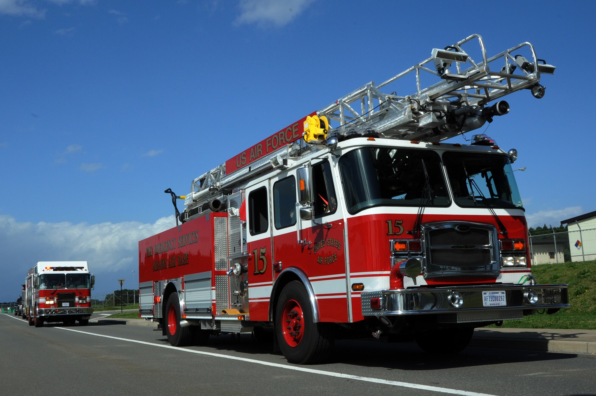 Firefighters from the 35th Civil Engineer Squadron wrap up Fire Prevention Week with a parade through the streets of Misawa Air Base, Japan, Oct. 12, 2013. The weeklong campaign concluded with an open house at the base fire station for the community and their families. (U.S. Air Force photo by Senior Airman Derek VanHorn)