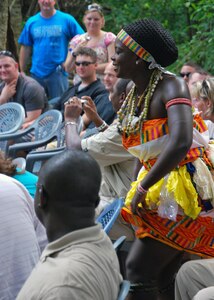 Shai dancers perform while musicians play to the U.S. troops participating in MEDFLAG 11, during a cultural presentation July 17, 2011 at Dodowa Forest, Ghana. The bilateral MEDFLAG 11 strengthens the relationship and interoperability between the U.S. and Ghana military forces through 10 days of collaborative training and sharing of medical expertise, as well as joint humanitarian civic assistance in local communities.