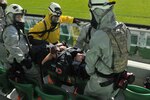 A team of Illinois National Guard Soldiers with the Chemical, Biological, Radiological, Nuclear and High Yield Explosives Enhanced Response Force Package treat a simulated casualty during the Epifactor 2011, a series of crisis management exercises held May 21 to 25, 2011, in Warsaw, Poland.