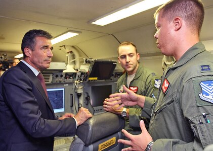 NATO Secretary General Anders Fogh Rasmussen talks with Georgia National Guard members during a May 9, 2011, visit at which he praised the state's service with NATO and participation in the National Guard State Partnership Program.