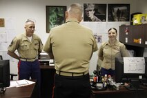 Maj. Gen. Mark A. Brilakis, Marine Corps Recruiting Command commanding general, talks with GySgt. Hunter J. Higgins, Recruiting Station Kansas City logistics chief, and Sgt. Cynthia Flores, RS Kansas City logistics clerk, during his recent visit to the RS Kansas City Headquarters Oct. 9, 2013. The visit offered the MCRC commanding general and sergeant major an opportunity to see the day-to-day operations of both the RS and the subsequent recruiting sub-stations of the RS.