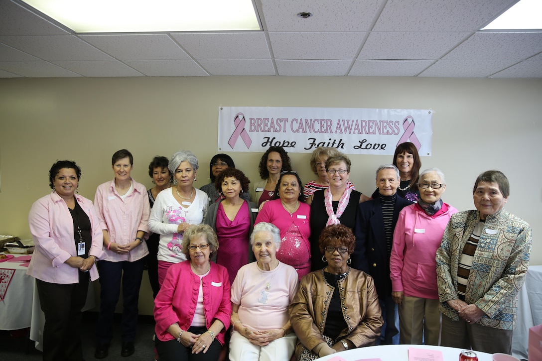 Breast cancer survivors of Marine Corps Base Camp Lejeune pose for a photo during the Breast Cancer Awareness Luncheon at the Religious Education Center at Tarawa Terrace, Oct. 10. The annual luncheon was created as an outlet for breast cancer survivors and recently diagnosed patients to seek information and help from people who already went through the ordeal, said Angel Cole, event coordinator.