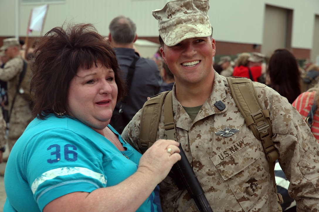 Marines embrace their friends and families after a long deployment