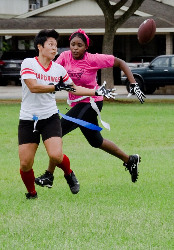 WarDawgs wide receiver Shannon Nagasako (left) and a Falcons' player pursue the ball during a Hawaii Gridiron League game at Kapiolani Park, Oct. 6, 2013. (U.S. Marine Corps photo by Kristen Wong)