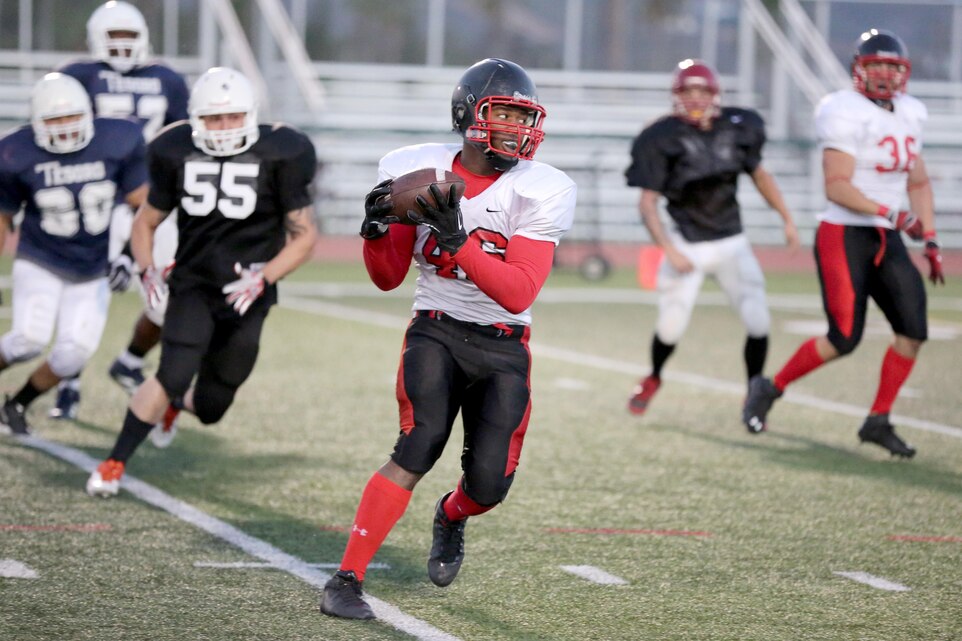 Corey Johnson, Falcons strong safety, intercepts a pass from the Marine Air Support Squadron 3 Blacklist quarterback at Paige Field House aboard Marine Corps Base Camp Pendleton, Calif. Oct. 15. The Falcons improved their record to 6-1 with one game left in the regular season.