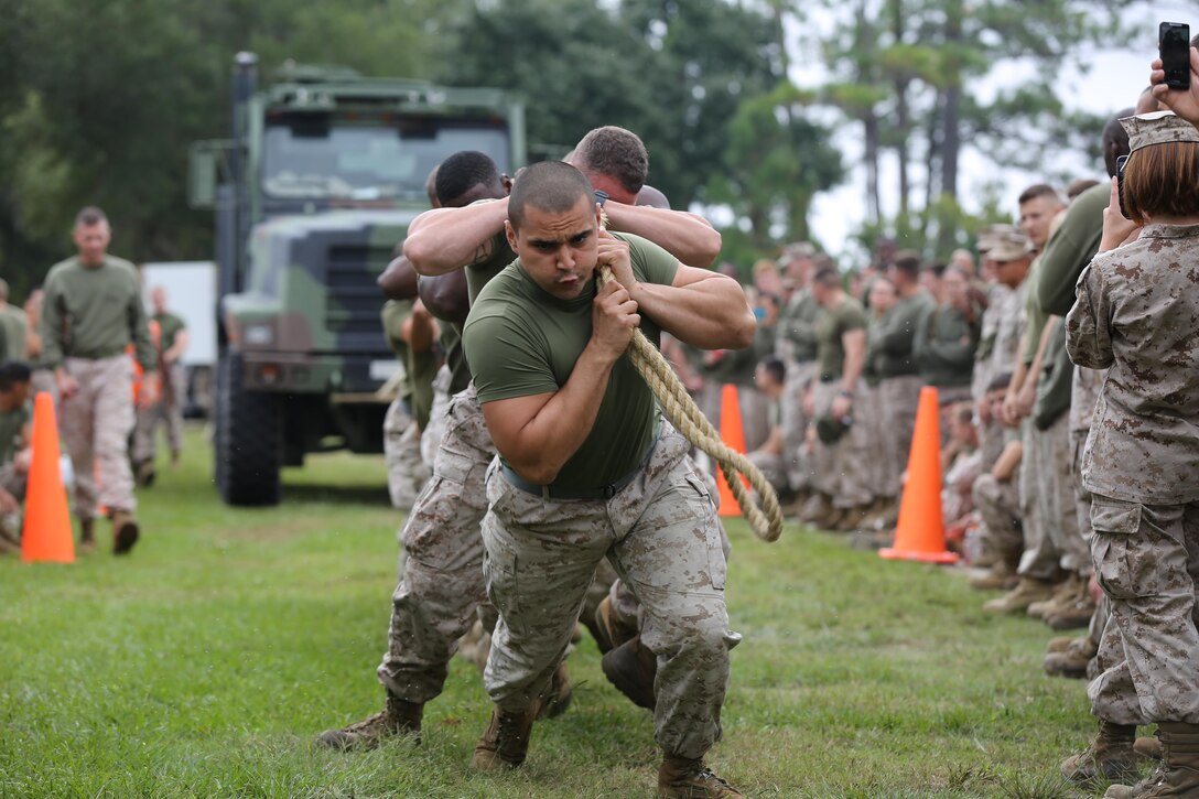 Marines from 2nd Marine Headquarters Group participate in a 7-ton truck pull as part of the Praetorian Challenge aboard Marine Corps Base Camp Lejeune, Oct. 11. Teams raced against the clock to pull the 7-ton truck across the finish line as fast as possible.