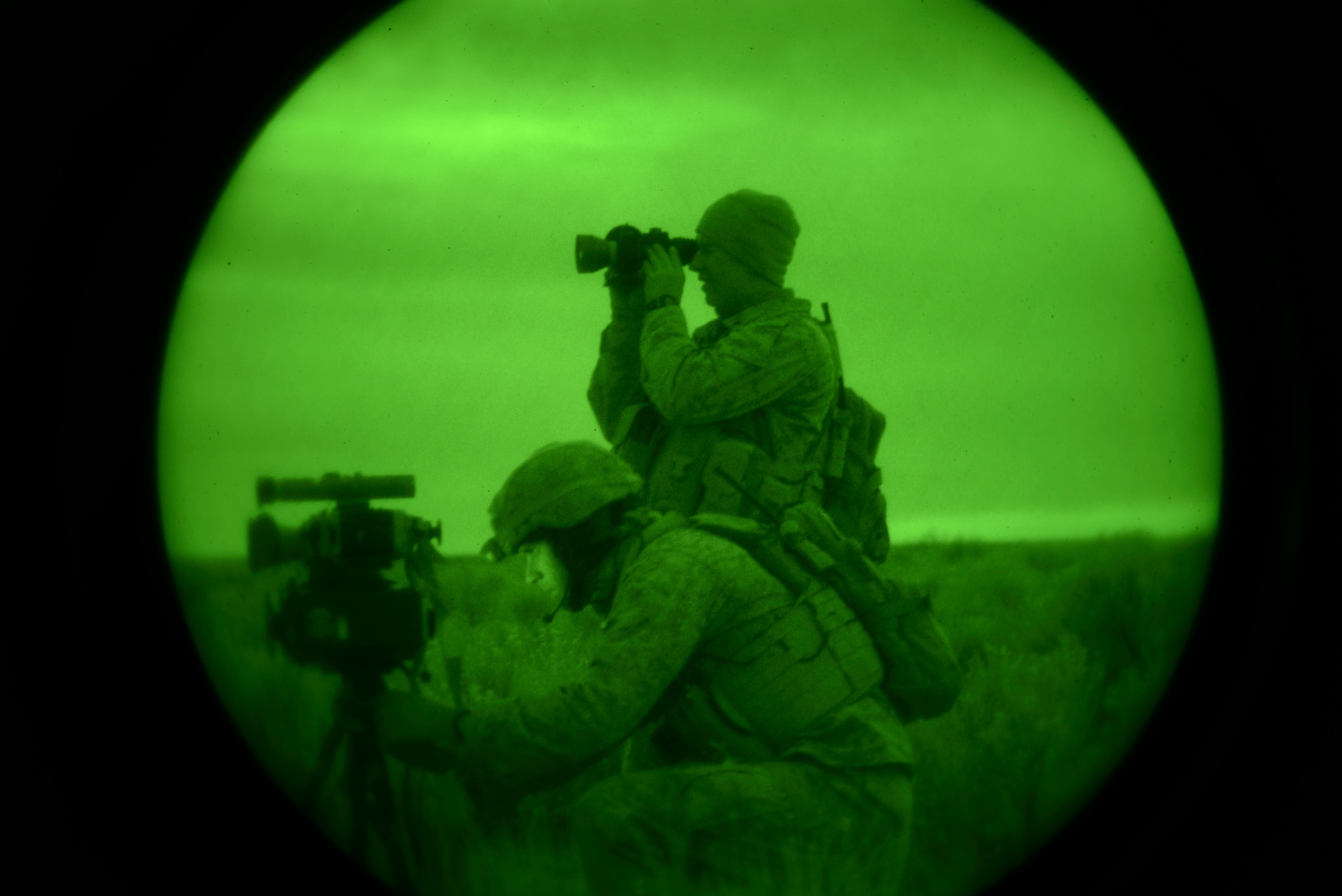 U.S. Marine Capt. Erich Lloyd, 1st Air Naval Gunfire Liaison Company Supporting Arms Liaison Team Delta forward air controller, directs close-air support as SALT-D member Cpl. Andrew Dimauro uses an infrared pointing and illuminating laser (or B.E. Meyer’s ‘IZLID’) to ‘paint’ targets for inbound AV-8B Harriers. The training was part of exercise Mountain Roundup at Mountain Home Air Force Base, Idaho, Oct. 8, 2013. (U.S. Air Force photo by Senior Airman Ben Sutton/RELEASED)