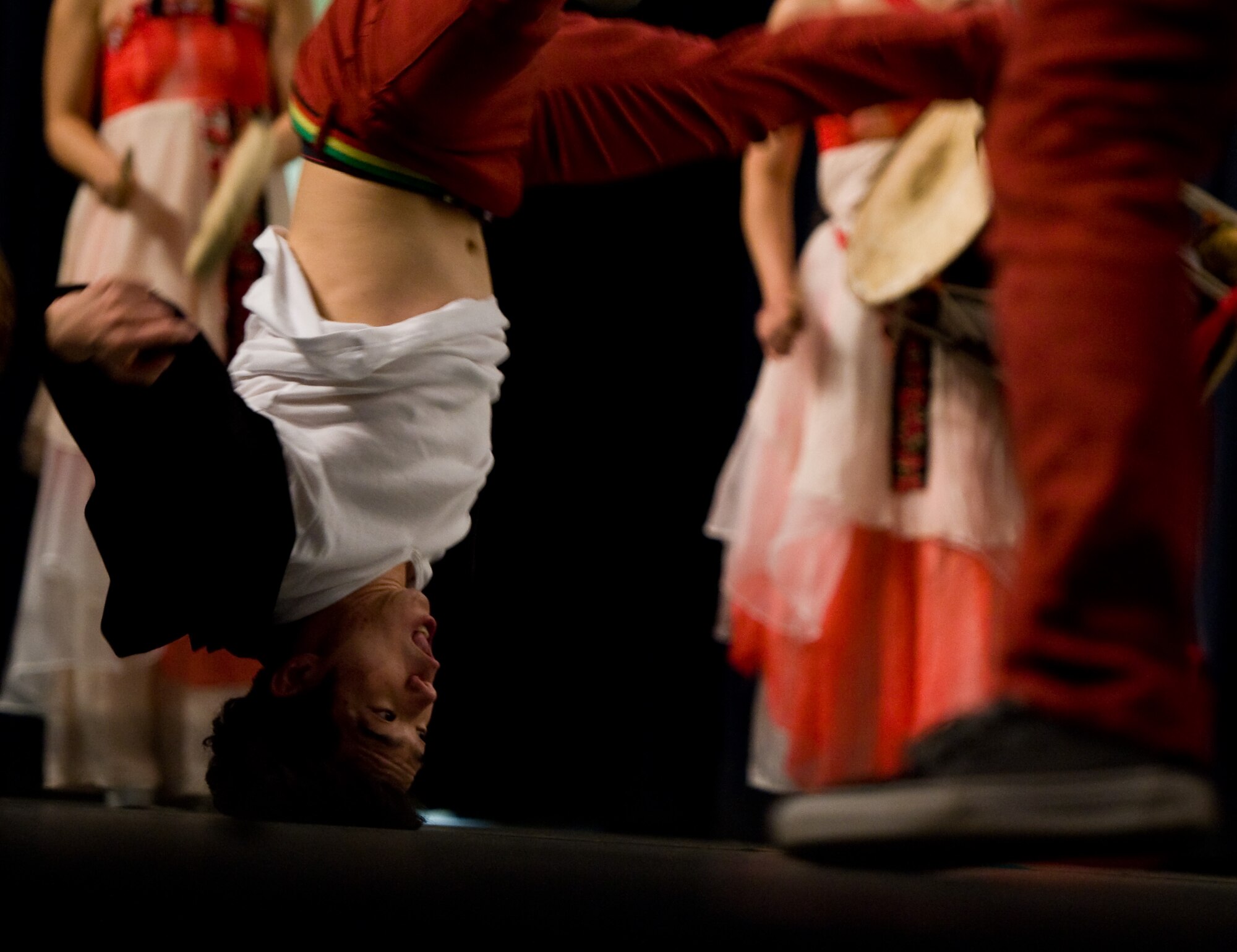 Dancers form the break dancing crew, Last for One, perform their opening dance dedicated to the Airmen at Kunsan Air Base, Republic of Korea, Oct. 15, 2013.  The Republic of Korea air force hosted the percussion group DoDo and break dancing crew Last for One for a concert here. The performers merged traditional Korean style drumming with western hip-hop style dancing. (U.S. Air Force photo by Senior Airman Armando A. Schwier-Morales/Released)