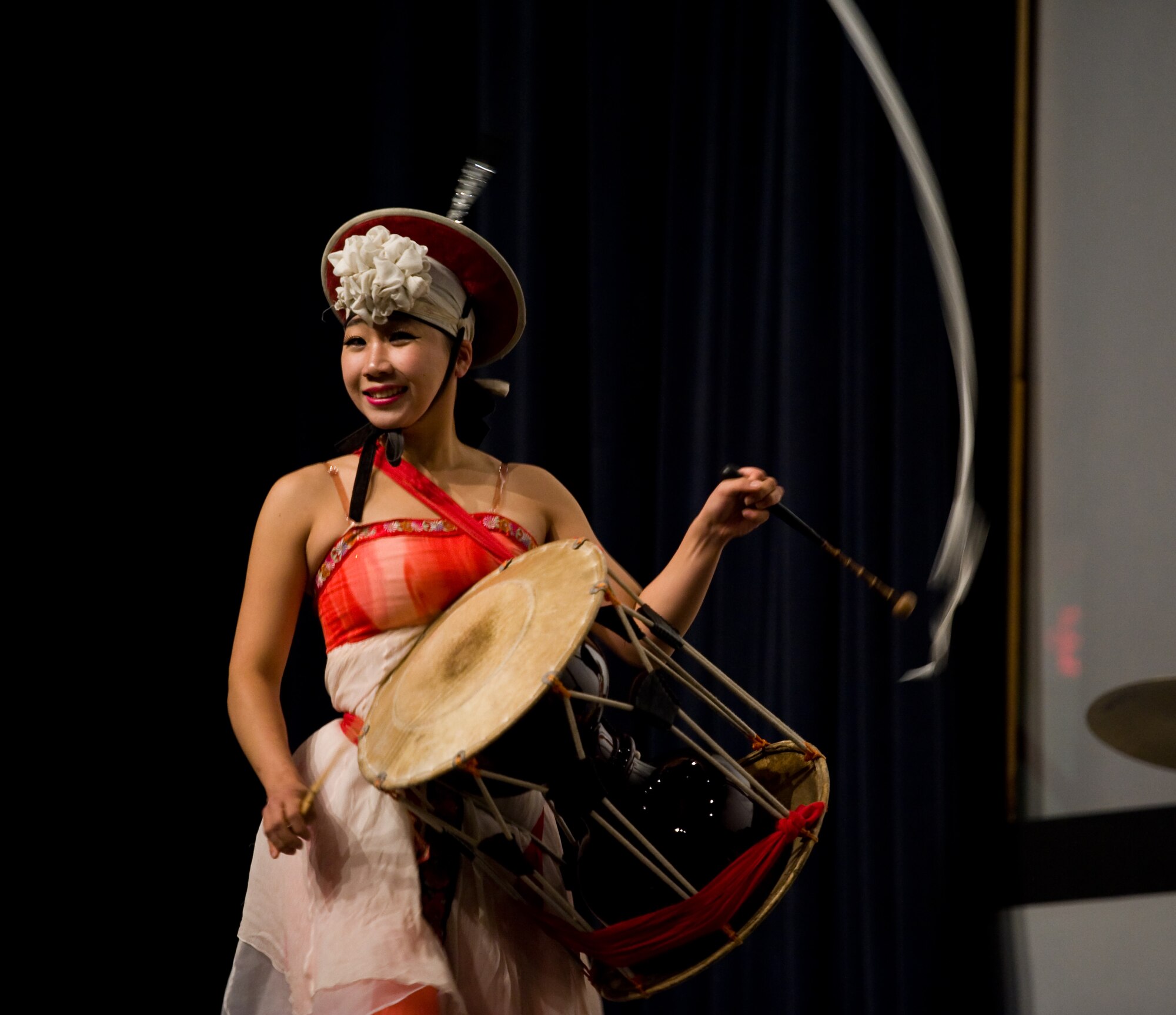 A member of the percussion group DoDo performs her drum solo for Airmen from the Republic of Korea and U.S. air forces at Kunsan Air Base, Republic of Korea, Oct. 15, 2013. The Republic of Korea air force hosted the percussion group DoDo and break dancing crew Last for One for a concert here. The performers merged traditional Korean style drumming with western hip-hop style dancing. (U.S. Air Force photo by Senior Airman Armando A. Schwier-Morales/Released)