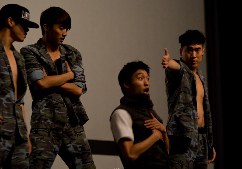 Last For One, a break dancing crew, performs for U.S. and Republic of Korea Airmen at Kunsan Air Base, Republic of Korea, Oct. 15, 2013. The Republic of Korea air force hosted the percussion group DoDo and break dancing crew Last for One for a concert here. The performers merged traditional Korean style drumming with western hip-hop style dancing. (U.S. Air Force photo by Senior Airman Armando A. Schwier-Morales/Released)