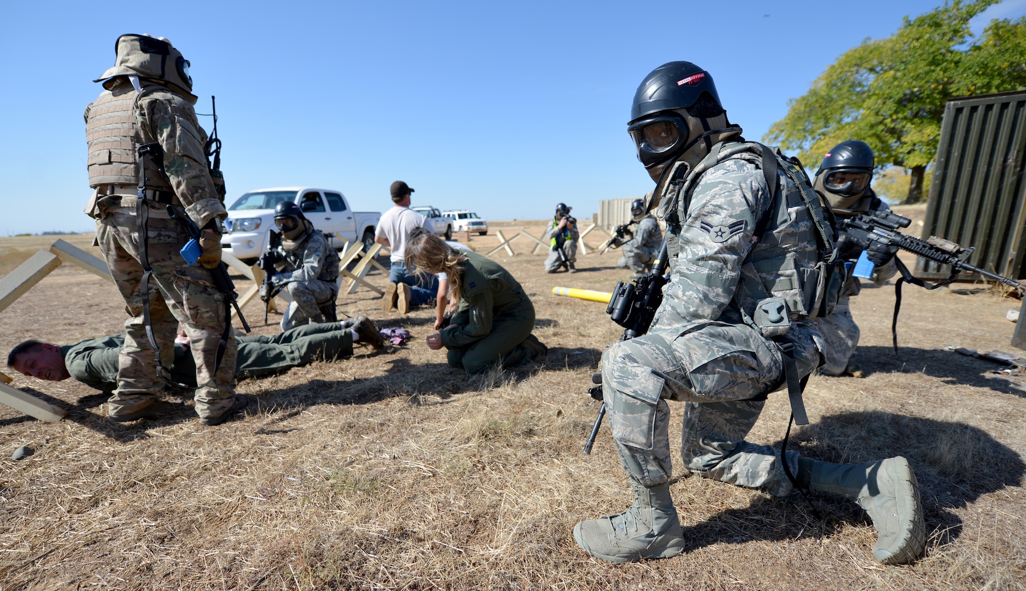 Airmen from the 9th Security Forces Squadron rescue two pilots during a pilot-rescue exercise at Beale Air Force Base, Calif., Oct. 9, 2013. Air Force contractors provided tactical insight and acted as opposition forces. (U.S. Air Force photo by Senior Airman Drew Buchanan/Released)