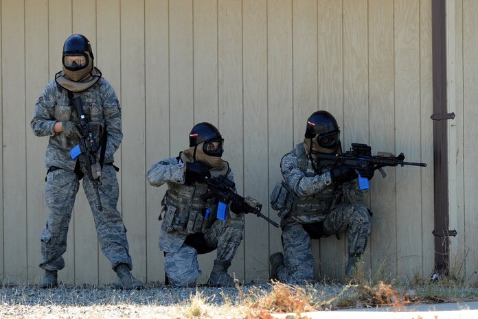 Members of the 9th Security Forces Squadron stack up during a pilot-rescue exercise at Beale Air Force Base, Calif., Oct. 9, 2013. The 9th SFS used simulation and blank rounds during the scenario to provide a greater sense of realism. (U.S. Air Force photo by Staff Sgt. Robert M. Trujillo/Released)   