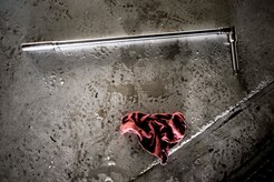 A breaker bar used to take off a tire from a C-17 Globemaster III and a used rag lie on the ground after 437th Maintenance Squadron crew chiefs performed a tire change Oct. 7, 2013, at Joint Base Charleston, S.C. For the crew chiefs to perform a tire change they first need to lift the aircraft off the ground using jacks. (U.S. Air Force photo/Senior Airman Dennis Sloan) 

