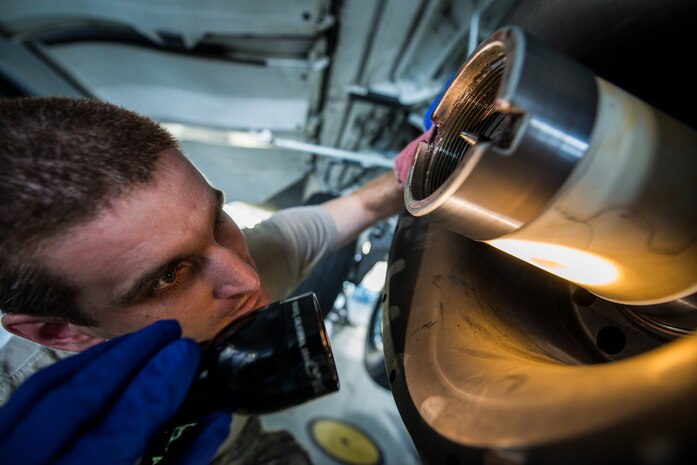 Staff Sgt. Ryan Sova, 437th Maintenance Squadron crew chief, uses a flashlight to check the inside of a gear to make sure nothing is damaged before putting a new tire on a C-17 Globemaster III Oct. 7, 2013, at Joint Base Charleston, S.C. For the crew chiefs to perform a tire change they first need to lift the aircraft off the ground using jacks. (U.S. Air Force photo/ Senior Airman Dennis Sloan)