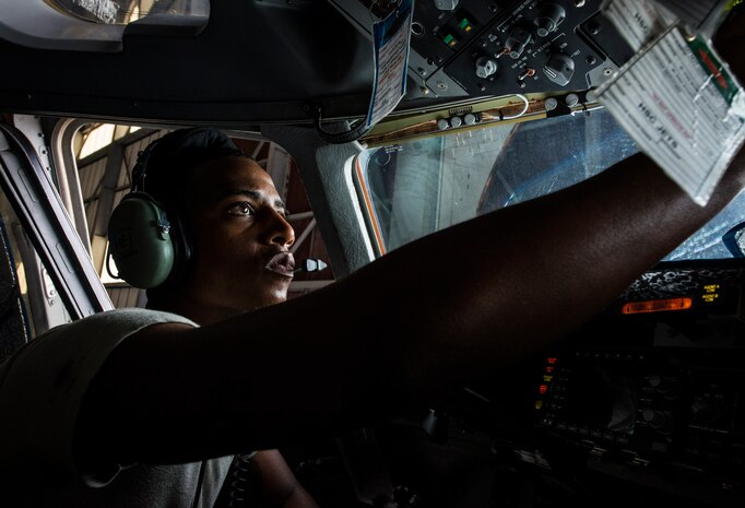 Staff Sgt. Darrell Walton, 437th Maintenance Squadron crew chief, sits in a C-17 Globemaster III checking to make sure all the gears are working Oct. 7, 2013, at Joint Base Charleston, S.C. A team of eight crew chiefs used six jacks to raise a C-17 Globemaster III off the ground to change a tire and inspect the gears. (U.S. Air Force photo/ Senior Airman Dennis Sloan)