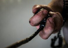 Staff Sgt. Ryan Sova, 437th Maintenance Squadron crew chief, pushes a button on a communication system to talk with another Airman in the cockpit while raising a C-17 Globemaster III using jacks Oct. 7, 2013, at Joint Base Charleston, S.C. A team of eight crew chiefs used six jacks to raise a C-17 Globemaster III off the ground to change a tire and inspect the gears. (U.S. Air Force photo/Senior Airman Dennis Sloan) 

