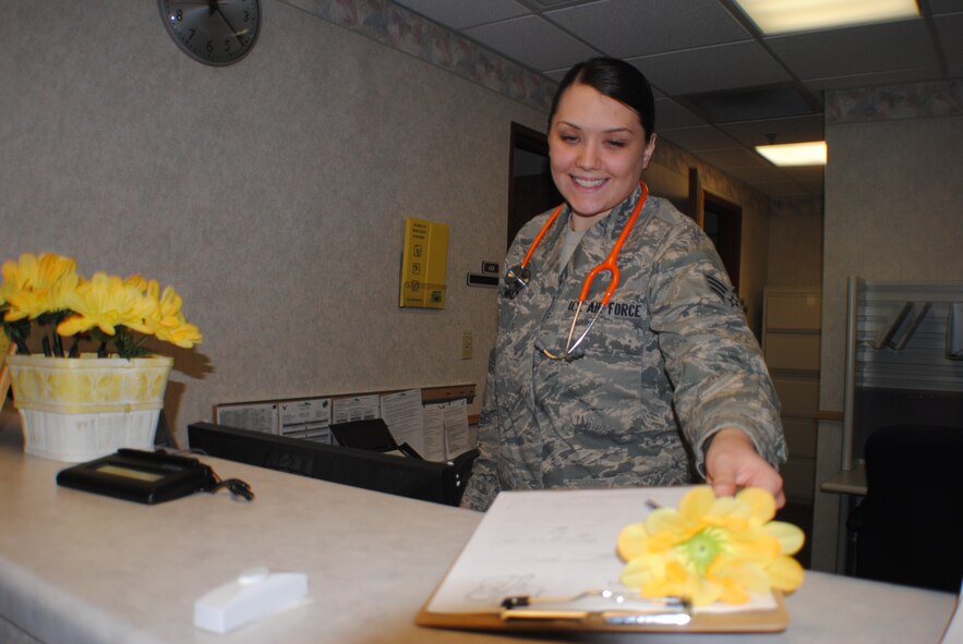 Senior Airman Samantha Conrad, 319th Medical Operations Squadron pediatric medical technician, prepares her work area to receive another patient at the pediatric clinic on Grand Forks Air Force Base, N.D., Oct. 15, 2013. Conrad sees an average of approximately 90 patients per month. (U.S. Air Force photo/Staff Sgt. Luis Loza Gutierrez) 