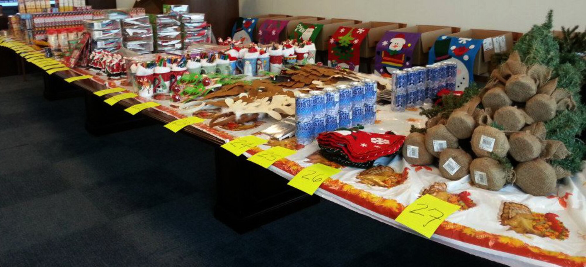 Items for the 2012 Air Force District of Washington holiday care packages sit sorted and ready for packing at Joint Base Andrews, Md. Four times a year the AFDW unit deployment manager, Annette Bonaro, coordinates the creation of holiday themed care packages for each Airman deployed from the command. (Courtesy photo)