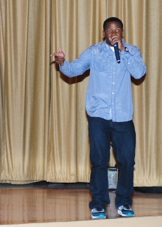 Chris Smiles raps during Air Force Sergeants Association Talent Showcase at the Beale Theater, Oct. 11, 2013. Audience voted via text message for their favorites, and the top two contestants move on to perform at Rhythm 105.9 FM’s talent showcase in Yuba City Calif., January 2014. (U.S. Air Force photo by Senior Airman Allen Pollard/Released)