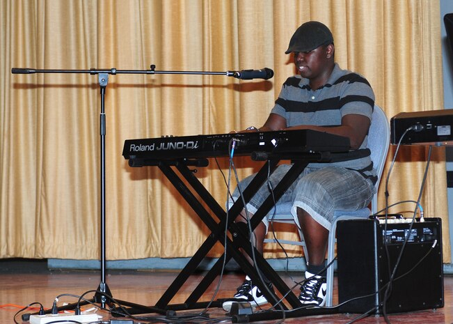 Christopher Tyler plays the keyboard and sings during Air Force Sergeants Association Talent Showcase at the Beale Theater, Oct. 11, 2013. The Beale Talent Showcase was hosted by the AFSA Chapter 1372. (U.S. Air Force photo by Senior Airman Allen Pollard/Released)