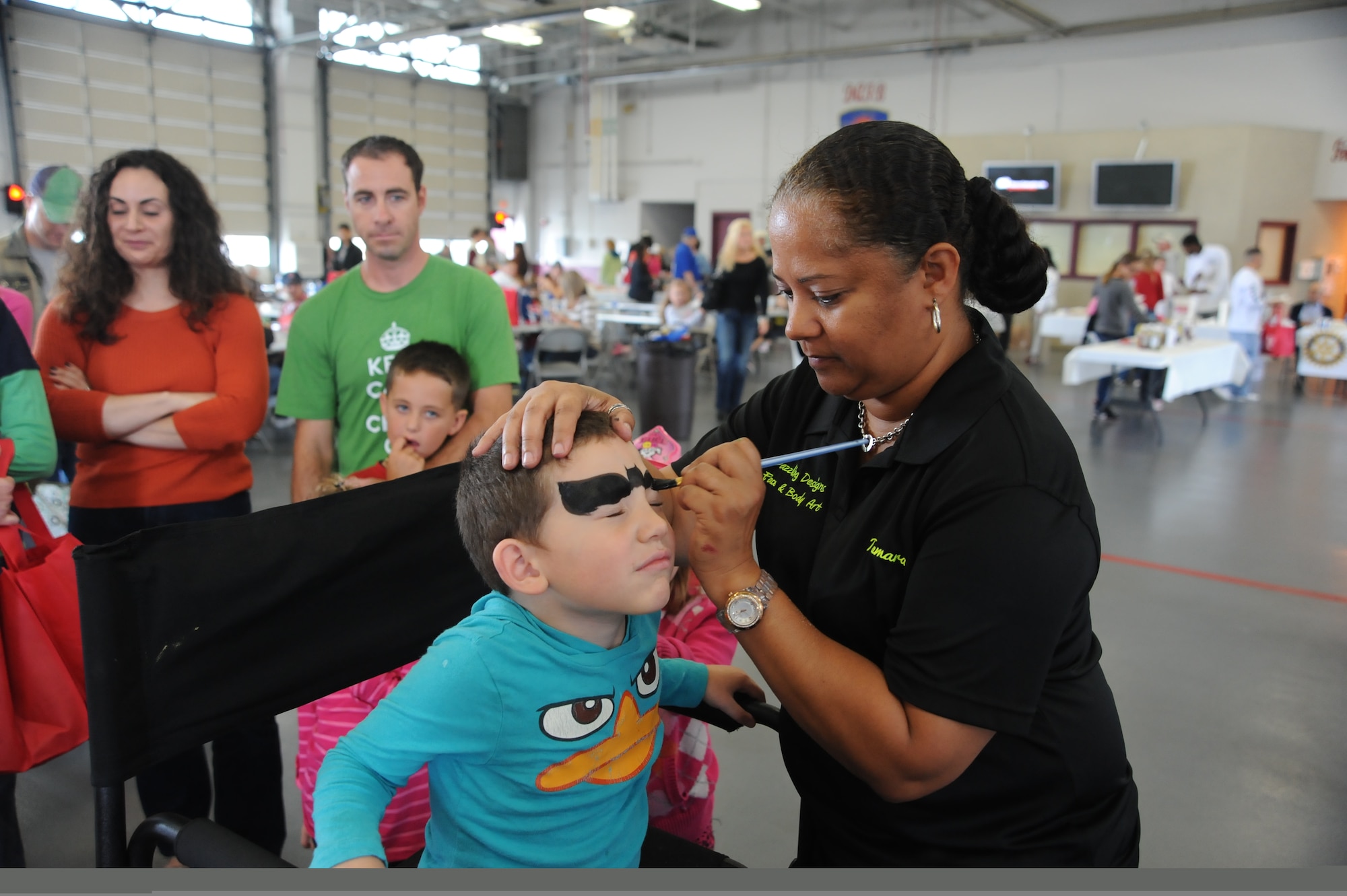 Kevin Mclain gets his face painted during the Military Appreciation Picnic Oct. 12, 2013, at the fire department on Dover Air Force Base, Del. Face painting was one of the many activities offered to military families at the picnic. (U.S. Air Force photo/Staff Sgt. Elizabeth Morris)