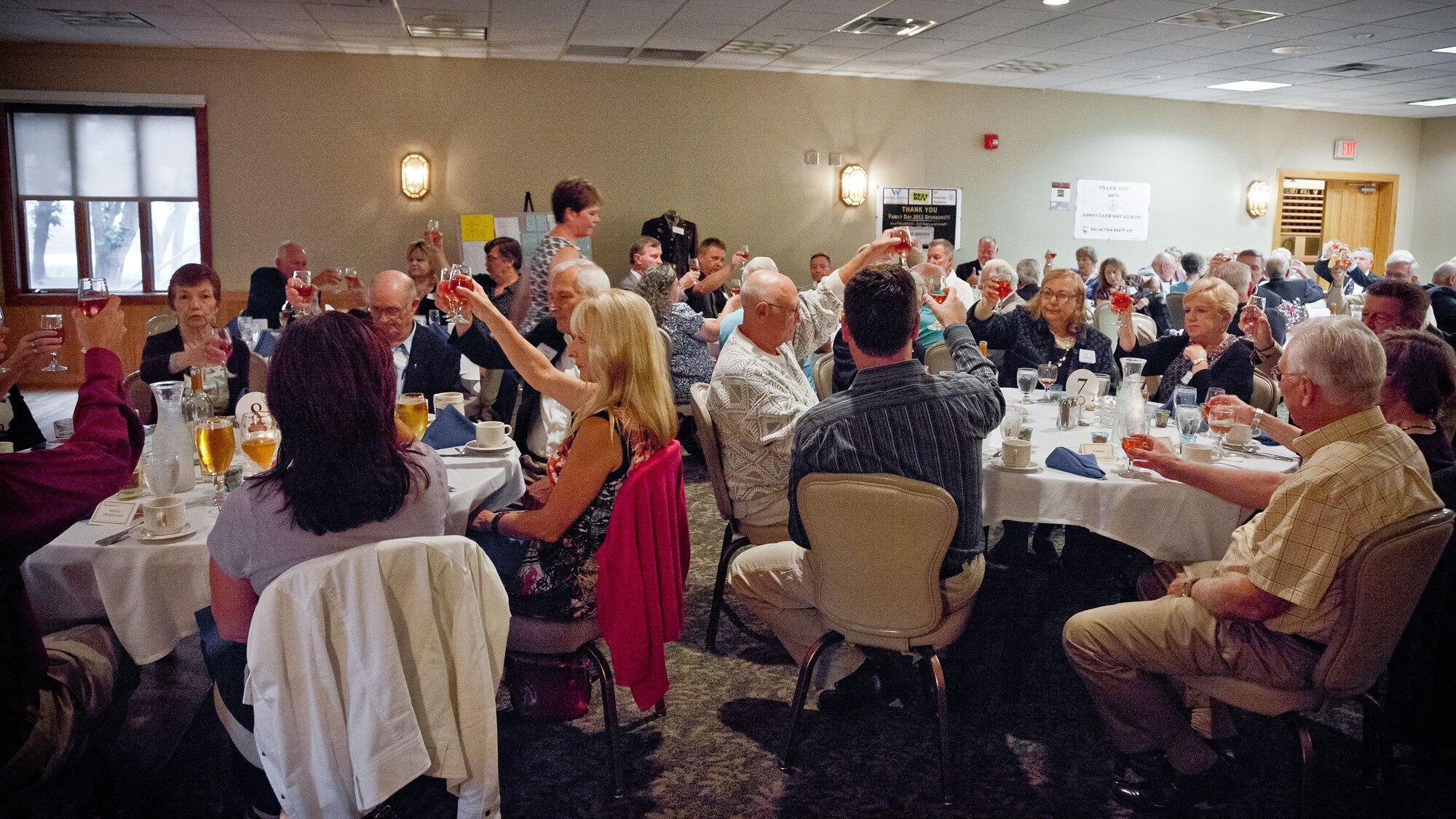 Members of the 96th Airlift Squadron Association raise a toast to those who could not join them for the reunion marking the 70th anniversary of the squadron, held in September at the Officer's Club at Minneapolis-St. Paul Air Reserve Station, Minn. (U.S. Air Force photo/Shannon McKay)