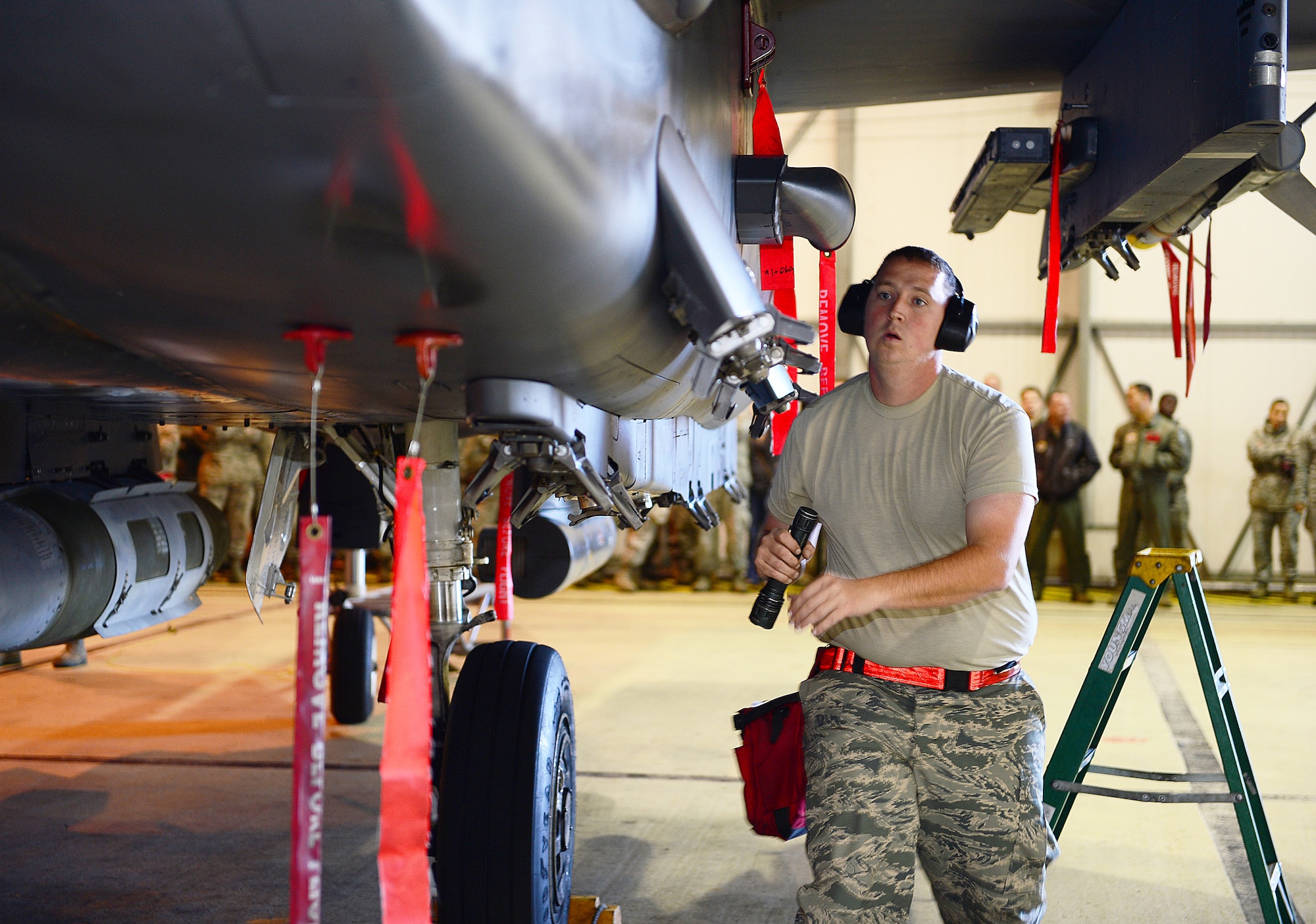 Staff Sgt. Frederick Manternach, 494th Aircraft Maintenance Unit weapons load crew team chief, inspects an F-15E Strike Eagle during the Royal Air Force Lakenheath, England, Load Crew of the Quarter competition Oct. 10, 2013. The competition featured the best load crew teams from the 492nd, 493rd, 494th AMUs and 48th Munitions Squadron. The winner was determined by the fastest time loading munitions with the least amount of errors. (U.S. Air Force photo by Airman 1st Class Dawn M. Weber/Released)