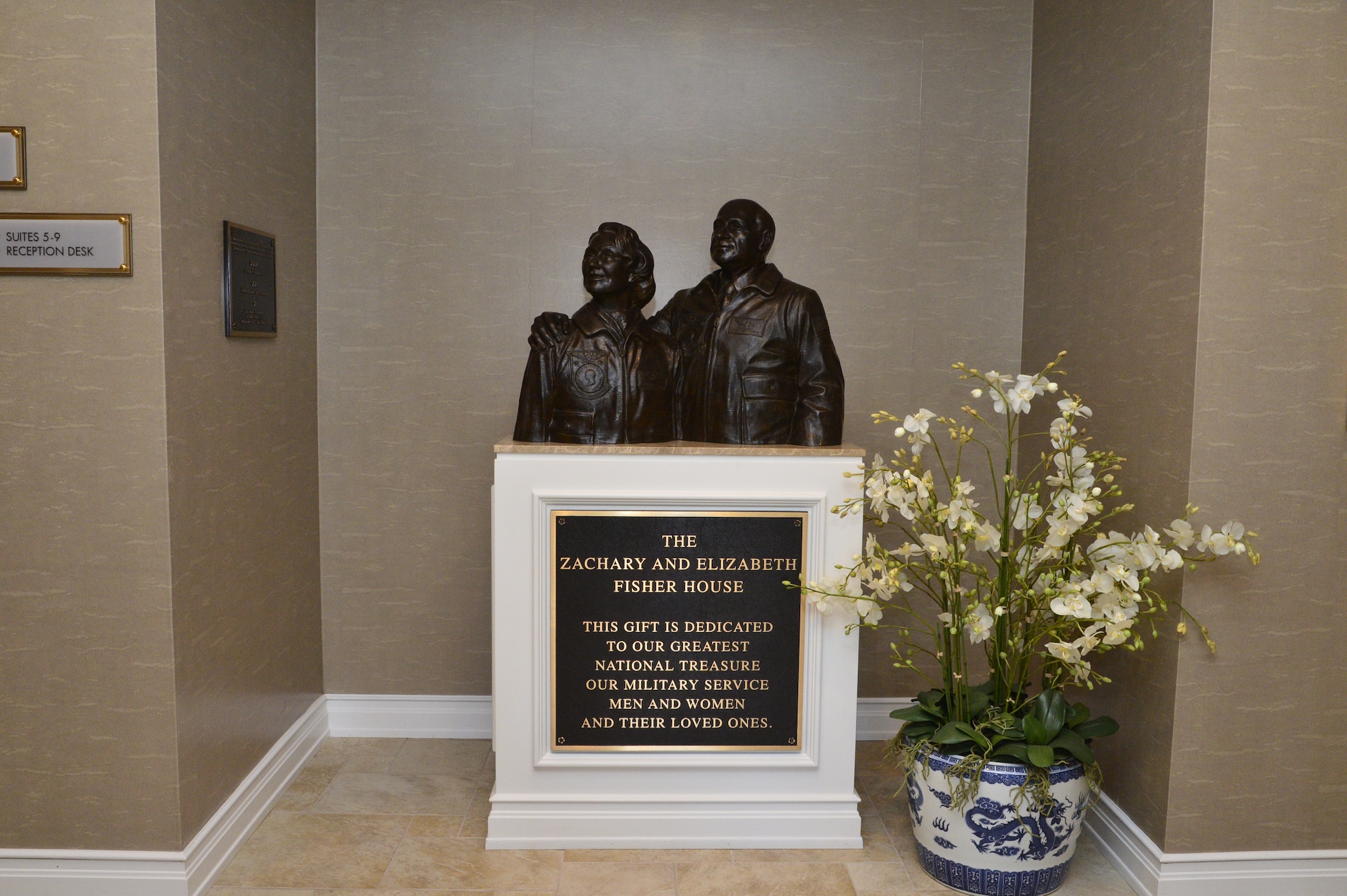 A statue honoring Zachary and Elizabeth Fisher sits inside the Fisher House for the Families of the Fallen June 4, 2013, on Dover Air Force Base, Del. The Fisher House Foundation dedicated and donated the house on Dec. of 2010 to serve fallen military members families. (U.S. Air Force photo/David Tucker)